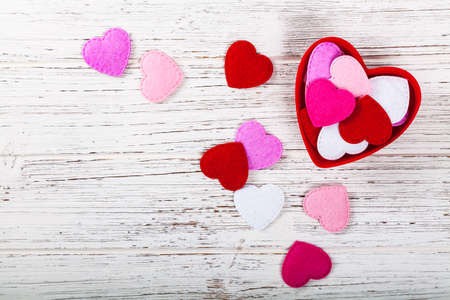 Valentines Day Background Card with Fabric Hearts over Wooden Background. Selective focus.の写真素材