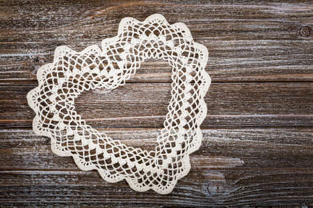 Valentines day background with Crochet Heart over wooden table. Selective focus.の写真素材