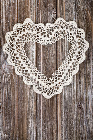 Valentines day background with Crochet Heart over wooden table. Selective focus.の写真素材