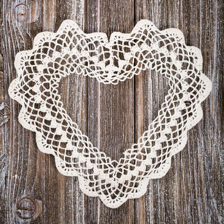 Valentines day background with Crochet Heart over wooden table. Selective focus.の写真素材