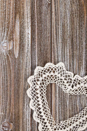 Valentines day background with Crochet Heart over wooden table. Selective focus.の写真素材
