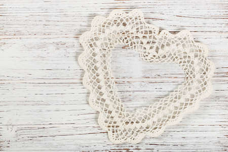 Valentines day background with Crochet Heart over white wooden table. Selective focus.の写真素材