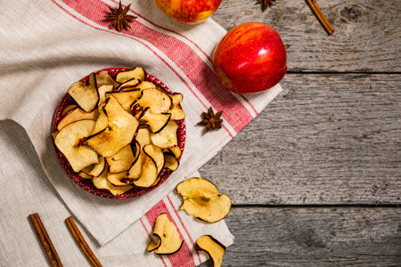 Baked Cinnamon Red Apple Chips. Selective focus.
