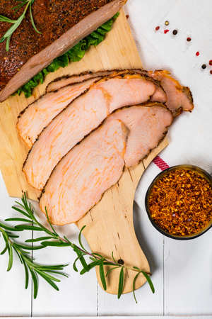 Cajun Style Roasted Turkey Breast Deli Sliced Lunch Meat on Wooden Background. Selective focus.の写真素材