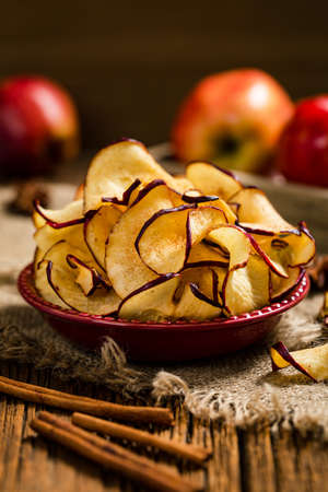 Baked Cinnamon Red Apple Chips. Selective focus.の写真素材