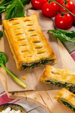 Spinach and Feta Cheese Strudel. Puff Pastry Filled with Spinach and Ricotta Cheese. Selective focus.の写真素材
