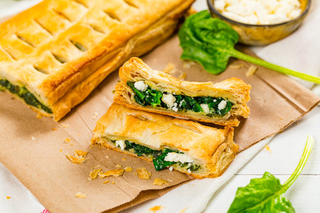 Spinach and Feta Cheese Strudel. Puff Pastry Filled with Spinach and Ricotta Cheese. Selective focus.の写真素材