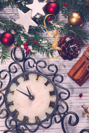 New Year Clock shows the time 5 minutes before the New year. Concept Background of Countdown to Celebrate New Year. Selective focus.の写真素材