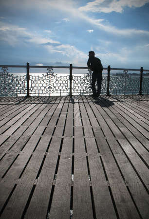 A young man looking into the distance, coast, Brighton, Pierのeditorial素材