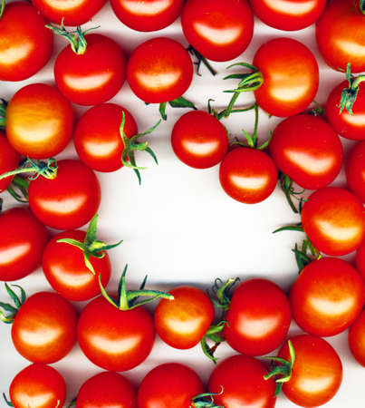 bright red tomatoes isolated on a white backgroundの写真素材