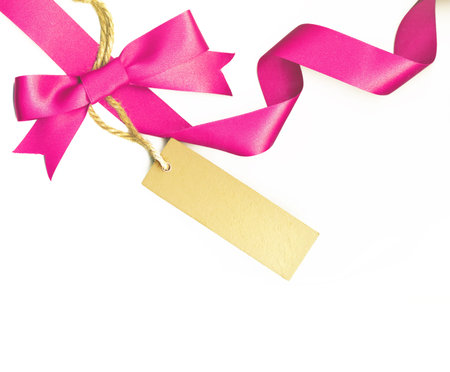 Pink ribbon with a label isolated on white