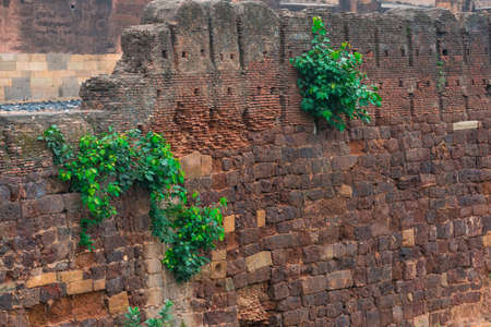 ancient wall of a protection of the temple, India, backgroundの写真素材