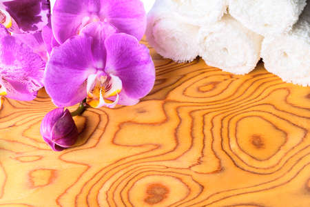 Spa concept with stacked of  towel and orchidの写真素材