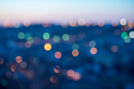 city lights abstract circular bokeh on blue backgroundの写真素材