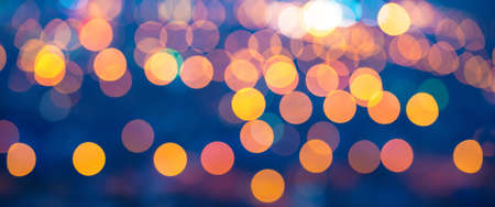 panorama merry christmas lights abstract circular bokeh on blue background, closeupの写真素材
