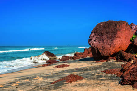 Beautiful tropical coast with big stones and black sand of the Indian Ocean. Varkala, Kerala. Indiaの写真素材