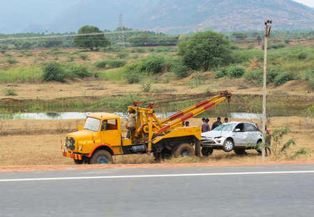 TRICHY, INDIA - FEBRUARY 15: After the accident, the car raise evacuate. India, Tamil Nadu, near Trichy. February 15, 2013のeditorial素材