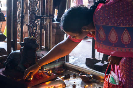 MADURAI, INDIA - FEBRUARY 16: An unidentified woman commits ritual actions at Sri Meenakshi Amman Temple. India, Tamil Nadu, Madurai. February 16, 2013のeditorial素材