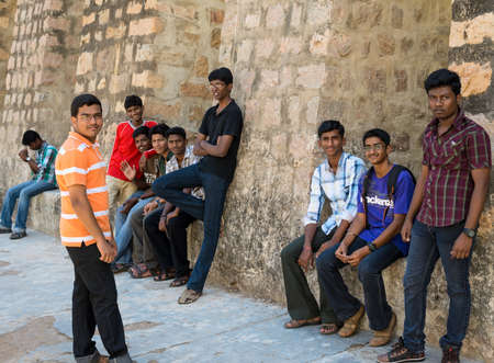 MADURAI, INDIA - FEBRUARY 16: An unidentified young men are standing at the walls of the ancient Tirumalai Nayak Palace. India, Tamil Nadu, Madurai. February 16, 2013のeditorial素材