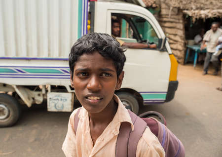 Thanjavur, India - February13: An unidentified student in uniform going home after classes at school. India, Tamil Nadu, near Thanjavur. February 13, 2013のeditorial素材
