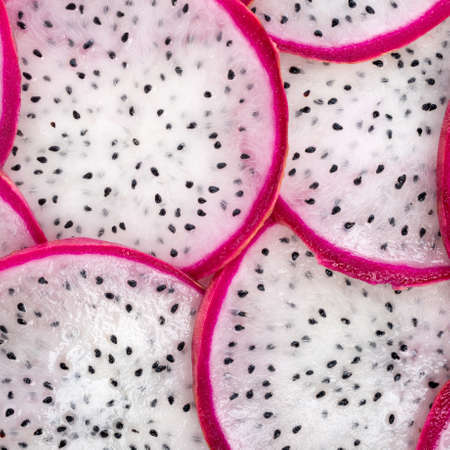 beautiful fresh sliced white with red rim dragon fruit  as background, Pitaya is the plant in Cactaceae family or Cactusの写真素材