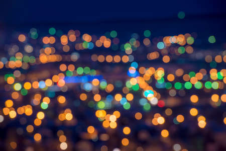 beautiful city lights background with blurring bokeh in twilight, closeupの写真素材