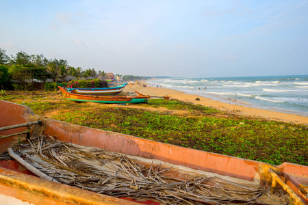 beautiful tropical coast with fishing boats at Indian Ocean. Tamil Nadu, India