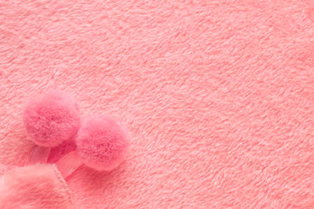 tender pink texture of towel like background with pompons, close upの写真素材