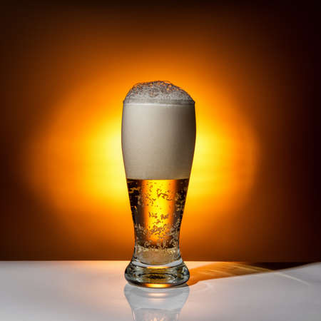 dark glass beer on light background, close upの写真素材