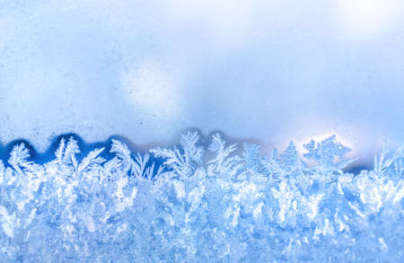 blue frost on window festive background, close upの写真素材