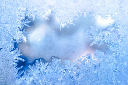 fairy winter ice, blue texture on window, holiday background, close upの写真素材