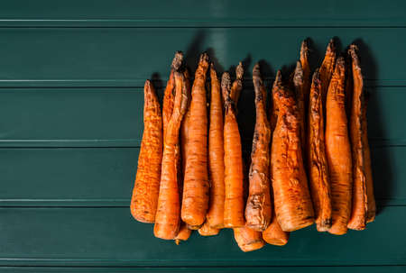 baked carrot on green background, healthy eatingの写真素材