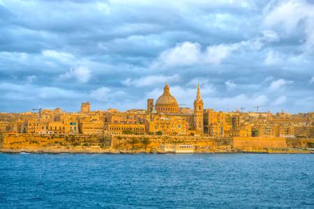 beautiful scene of Basilica Our Lady Mount Carmel in Valletta from Sliema, Maltaの写真素材
