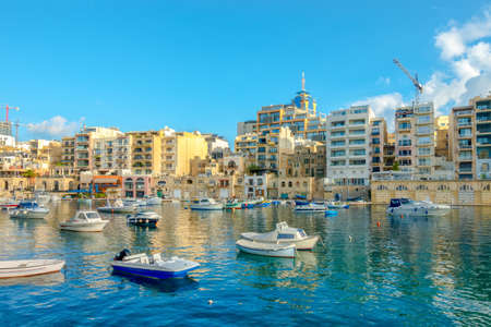 beautiful european harbor with maltese yachts and boats in Sliema, Spinola Bay, Maltaの写真素材