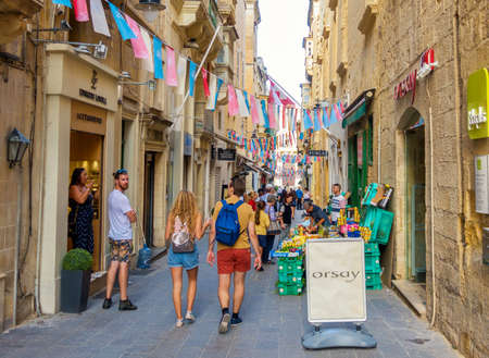 Valletta, Malta, October 19, 2017: picturesque narrow street and tourists のeditorial素材