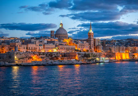 beautiful european landscape with Basilica Our Lady Mount Carmel to Valletta from Sliema, Maltaの写真素材