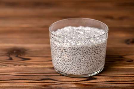 chia seed pudding in glass on wooden background, minimal designの写真素材