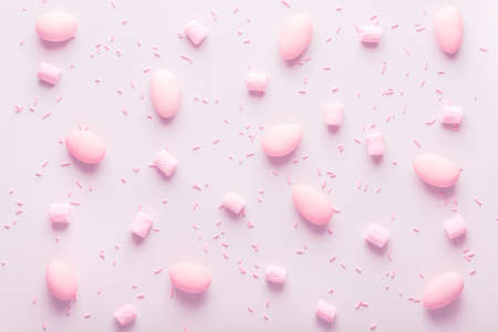 Sugared almonds candy, marshmallow and sprinkle for wedding, pink backgroundの写真素材