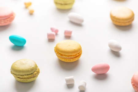 colorful macarons cookies on light background, have a good time conceptの写真素材