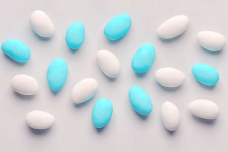 Top down of blue and white sugared almond candies like festive background with copy spaceの写真素材