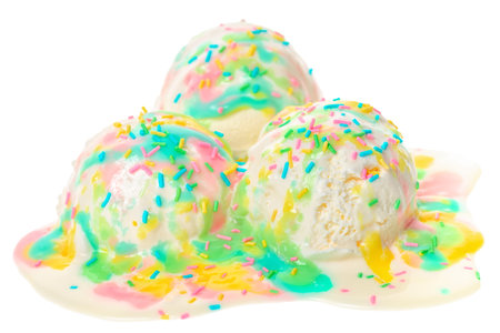 white melting scoop of sundae ice cream with rainbow glaze and sprinkles isolated on white background, summer creative conceptの写真素材