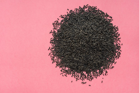 heap of black sprinkles for background of design banner, poster, flyer, card, postcard, cover,...