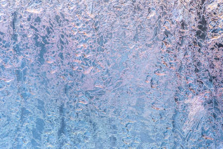 abstract winter ice texture on window, festive frost patterns background, close upの写真素材