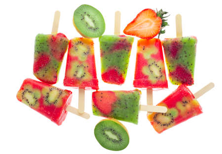 Handmade ice popsicles decorated kiwi and strawberry isolated on whiteの写真素材