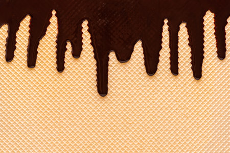 Golden waffle texture with chocolate glaze like  for your designの写真素材