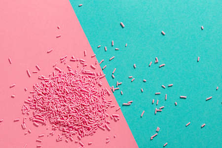 bright trendy pattern of colorful sprinkles for background of design banner, poster, flyer, card, postcard, cover, brochure over pink and blueの写真素材