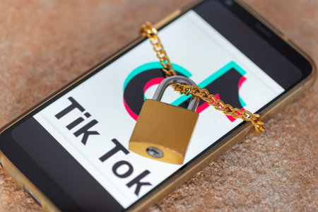 Saratov, Russia, March 13, 2022: Phone with Youtube social network logo with closed padlock on...