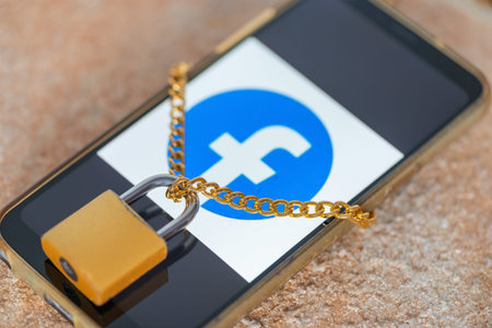 Saratov, Russia, March 13, 2022: Phone with Youtube social network logo with closed padlock on...