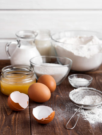 Ingredients for the pancake on the wooden table
