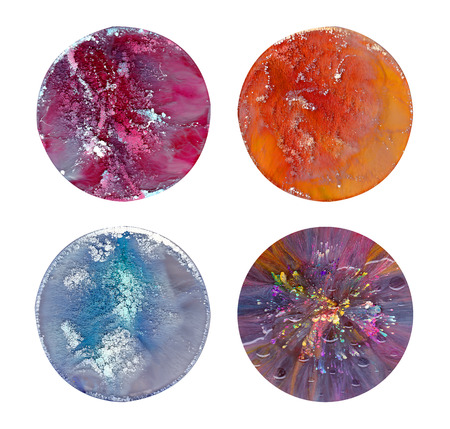 Fluid art in a petri dish. Colorful acrylic, ink, oil and watercolor marble paint splashes.の写真素材